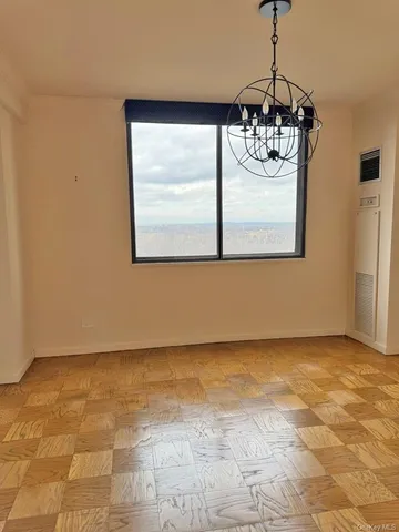 a view of a room with a chandelier and garage