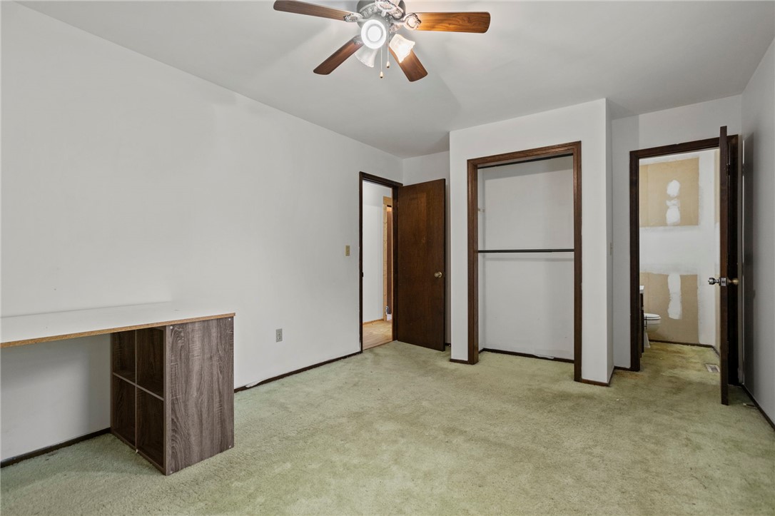 1022 Lakemont Road Starr, SC 29684 - Photo 19 of 24 A spacious bedroom featuring classic wood trim and direct access to an en-suite bathroom.