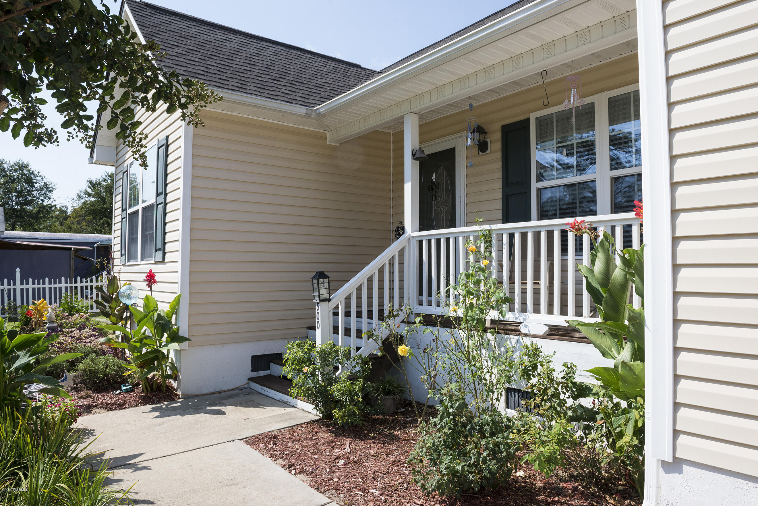 500 Bogue Loop Road Bogue, NC 28570 - Photo 3 of 31 Beautiful landscaping will make you smile every day!