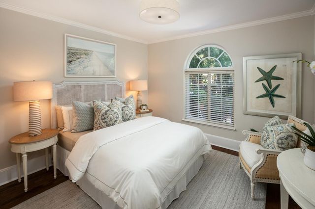 a spacious bedroom with a bed and a table