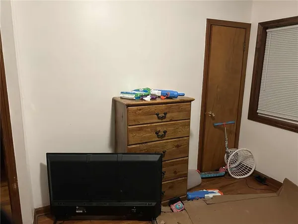 a room with a chair and a mirror