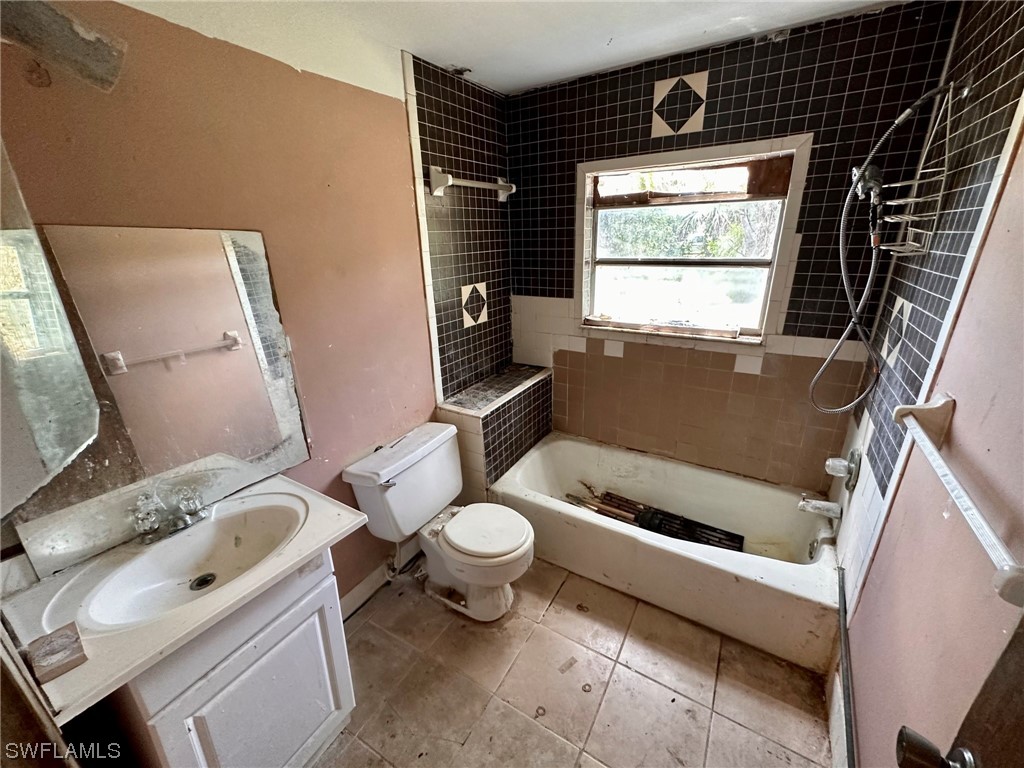 2012 Wright Street Fort Myers, FL 33916 - Photo 15 of 20 a bathroom with a sink toilet and window