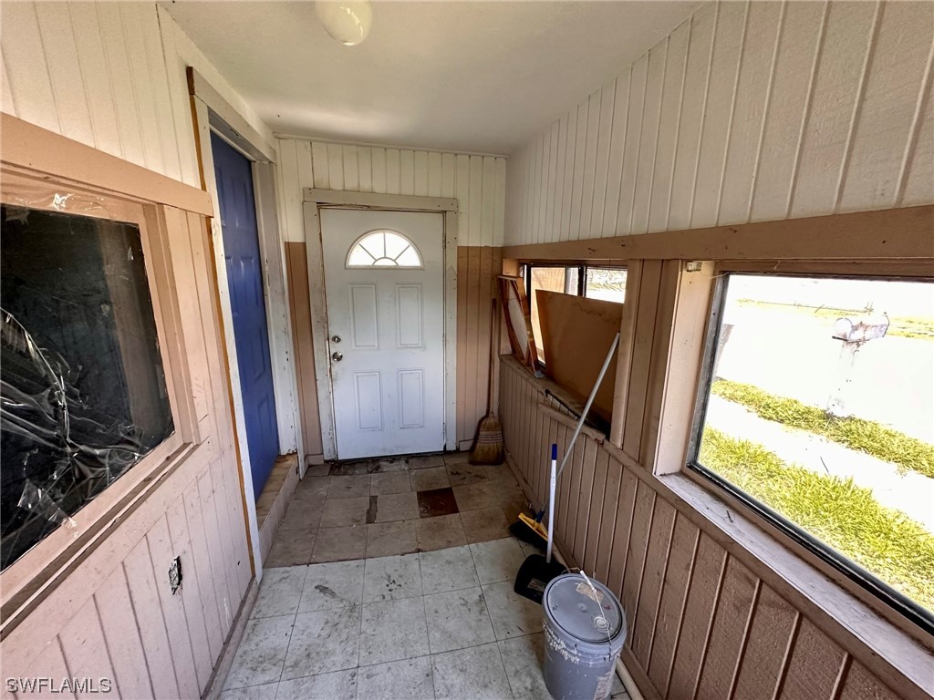 2012 Wright Street Fort Myers, FL 33916 - Photo 6 of 20 a view of a hallway with wooden floor and stairs