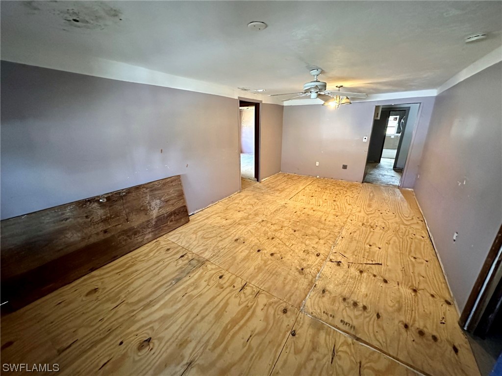 2012 Wright Street Fort Myers, FL 33916 - Photo 7 of 20 a bedroom with a bed and a chandelier