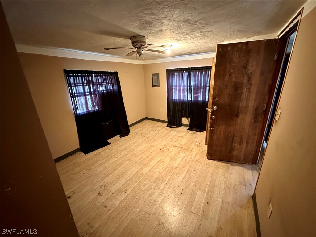 2012 Wright Street Fort Myers, FL 33916 - Photo 10 of 20 a bedroom with a bed closet and a mirror