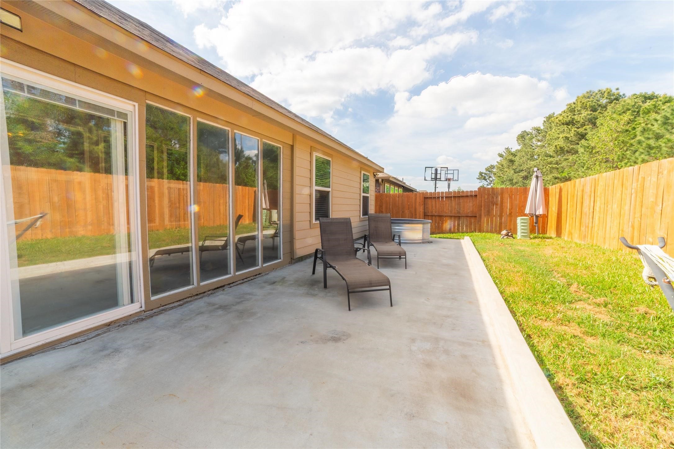 10510 Chestnut Path Way Tomball, TX 77375 - Photo 17 of 18 View of extended concrete patio in the backyard