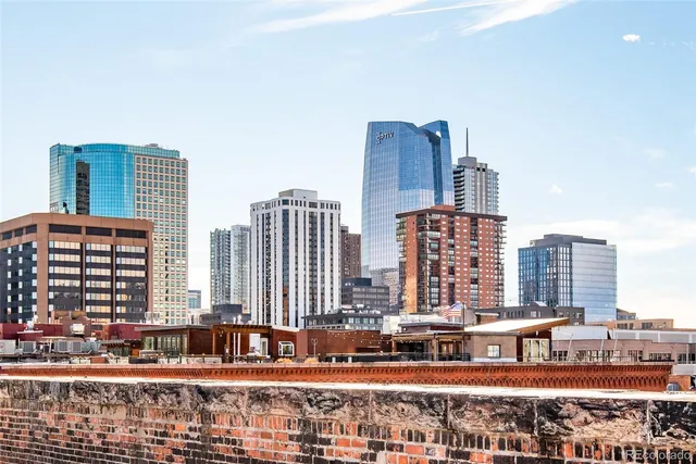 a view of city with tall buildings