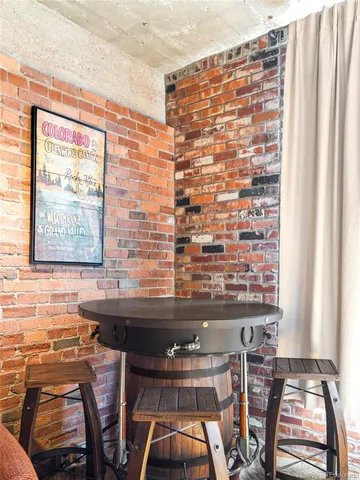 a view of a dining room with furniture and window