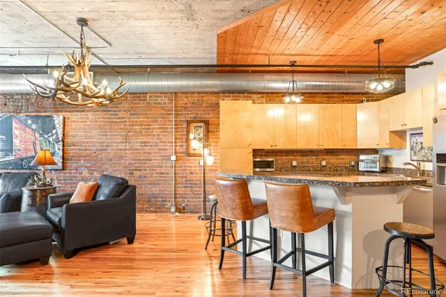 a living room with a table and chairs