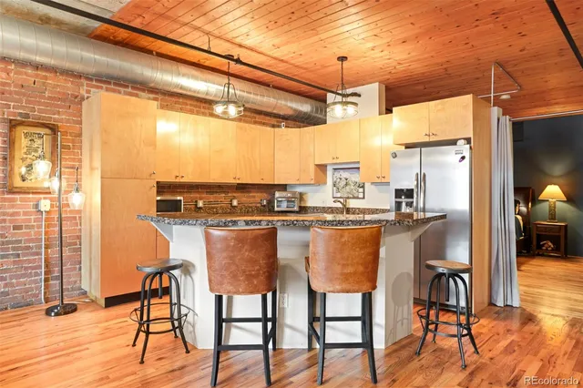 a dining table chairs next to a yard