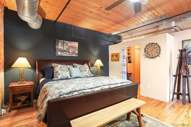 a bedroom with a bed and a table in it