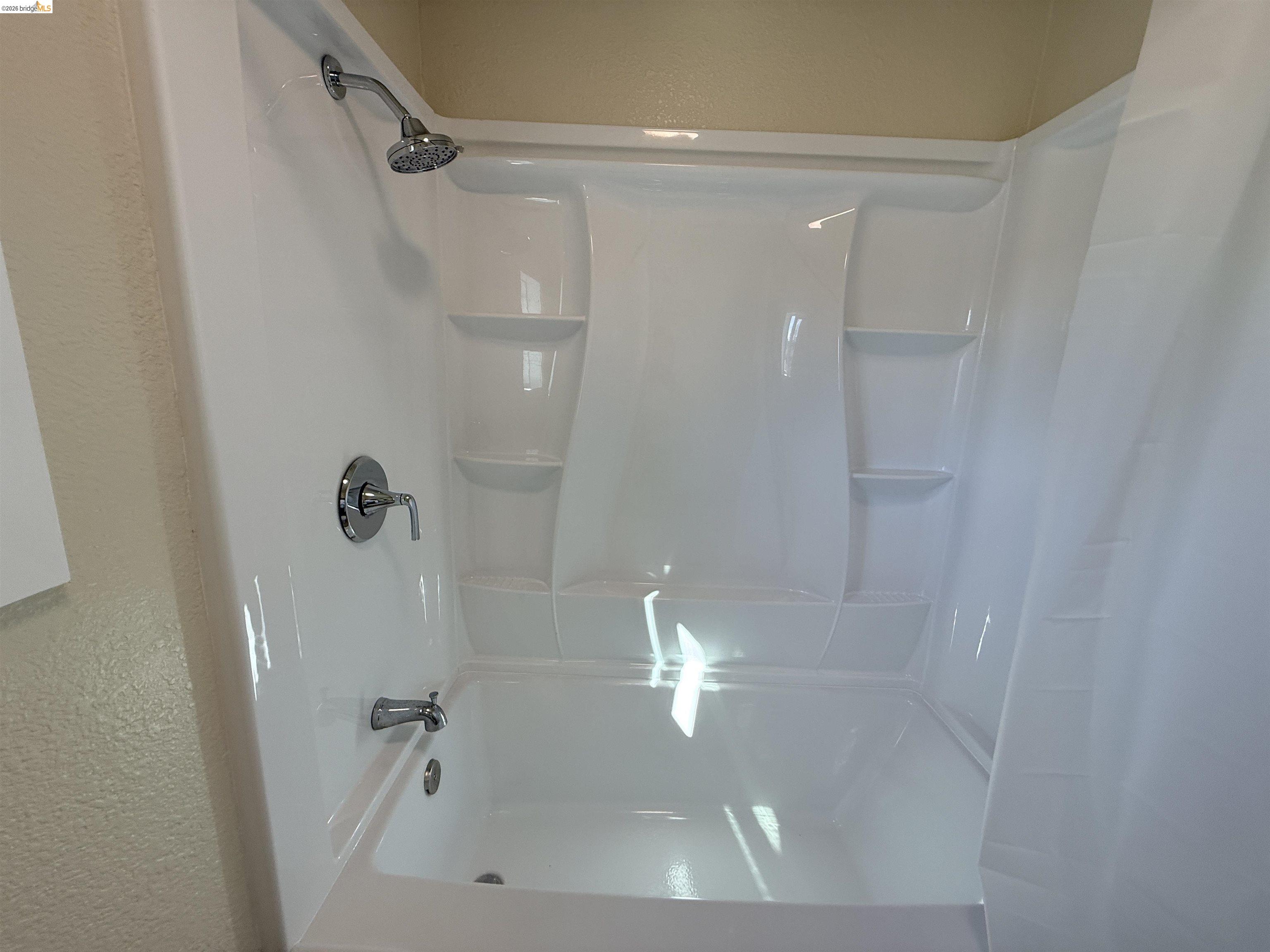 321 Benicia Road Vallejo, CA 94590 - Photo 12 of 48 Bathroom featuring a textured wall and shower / bath combo