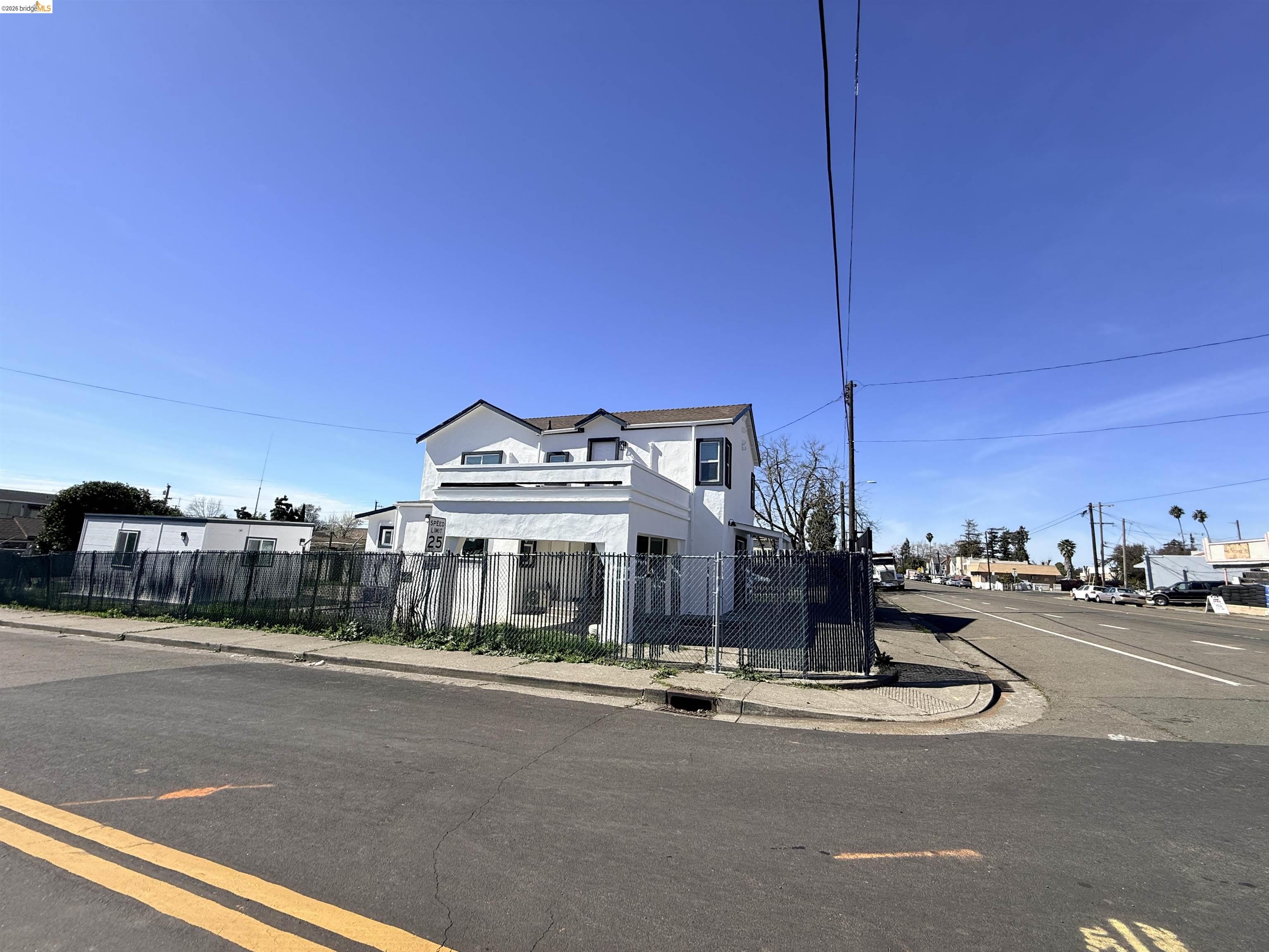 321 Benicia Road Vallejo, CA 94590 - Photo 28 of 48 View of front facade featuring a fenced front yard and stucco siding