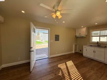 a kitchen with a sink and cabinets