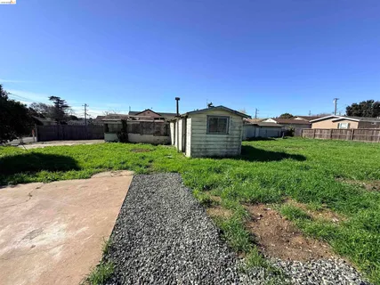a view of a backyard with sitting area