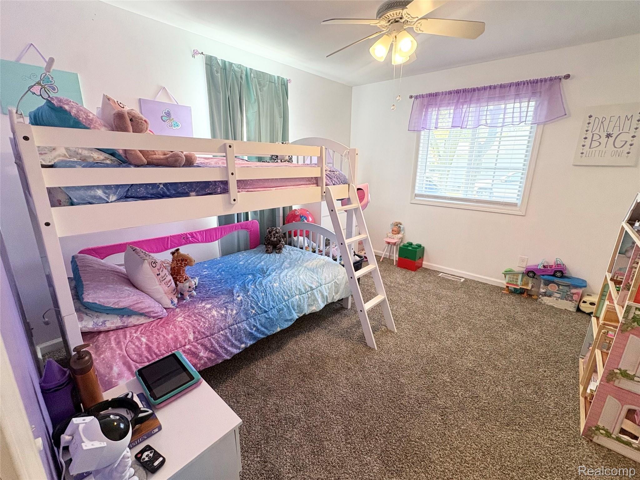 2230 North Center Road Burton, MI 48509 - Photo 15 of 21 Bedroom featuring dark colored carpet and a ceiling fan