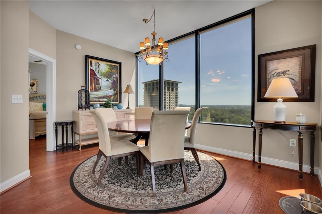 2828 Peachtree Road Northwest, Unit 1901 Atlanta, GA 30305 - Photo 8 of 35 a view of a a dining room with furniture window and wooden floor