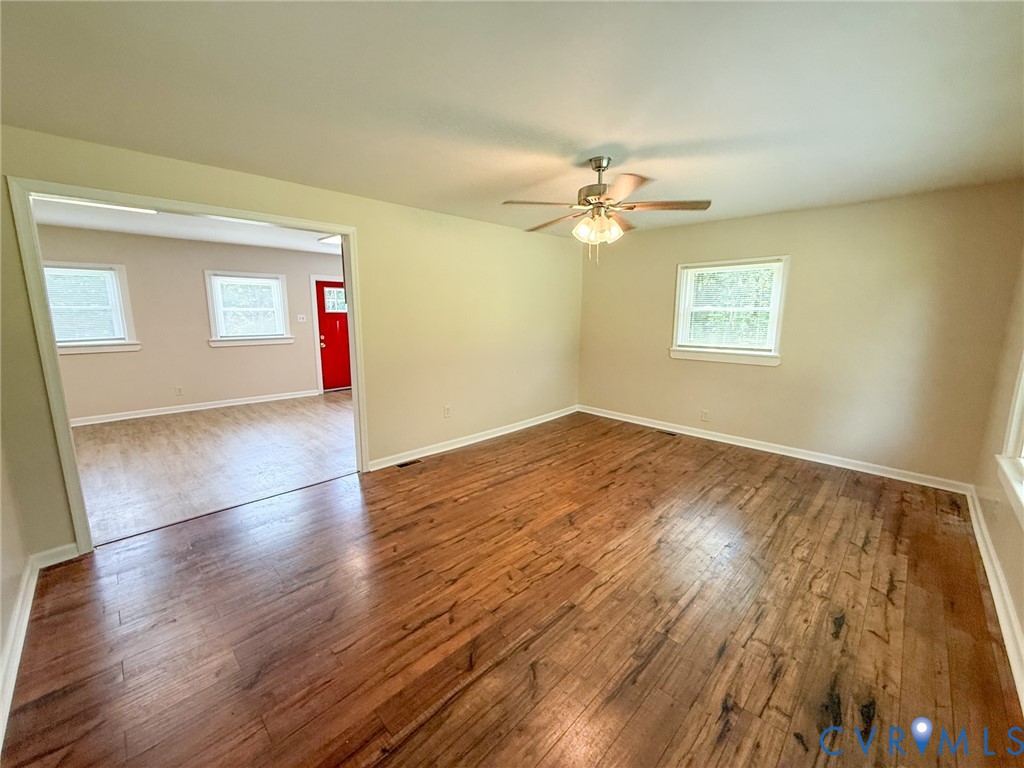 7798 West Courthouse Road Burkeville, VA 23922 - Photo 3 of 23 Spacious room featuring wood-finish flooring and a