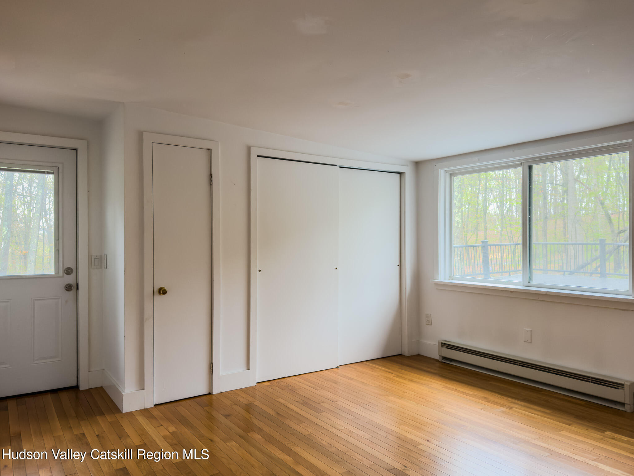 41 Pond Hill Road Copake, NY 12521 - Photo 15 of 25 a view of an empty room with wooden floor and a window