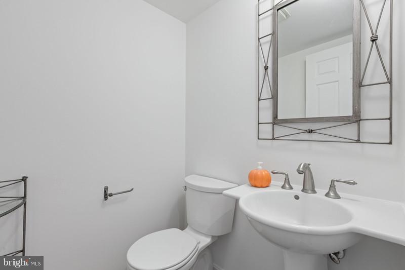6701 Fairfax Road, Unit 76 Chevy Chase, MD 20815 - Photo 17 of 42 a white toilet sitting next to a bathroom sink