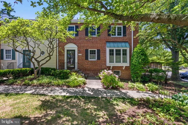 6701 Fairfax Road, Unit 76 Chevy Chase, MD 20815 - Photo 2 of 42 a front view of a house with lots of trees around it