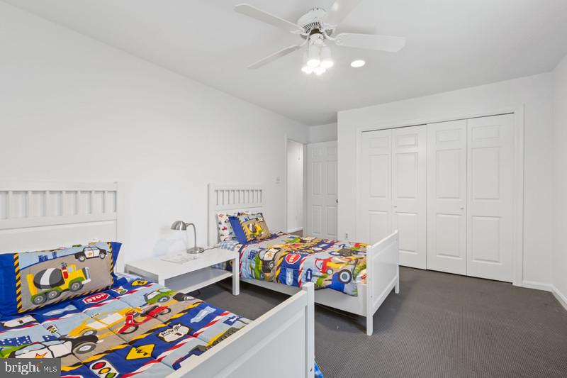 6701 Fairfax Road, Unit 76 Chevy Chase, MD 20815 - Photo 25 of 42 a bedroom with furniture and a baby crib