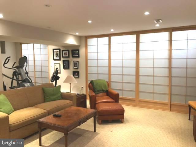 6701 Fairfax Road, Unit 76 Chevy Chase, MD 20815 - Photo 28 of 42 a living room with furniture and a large window