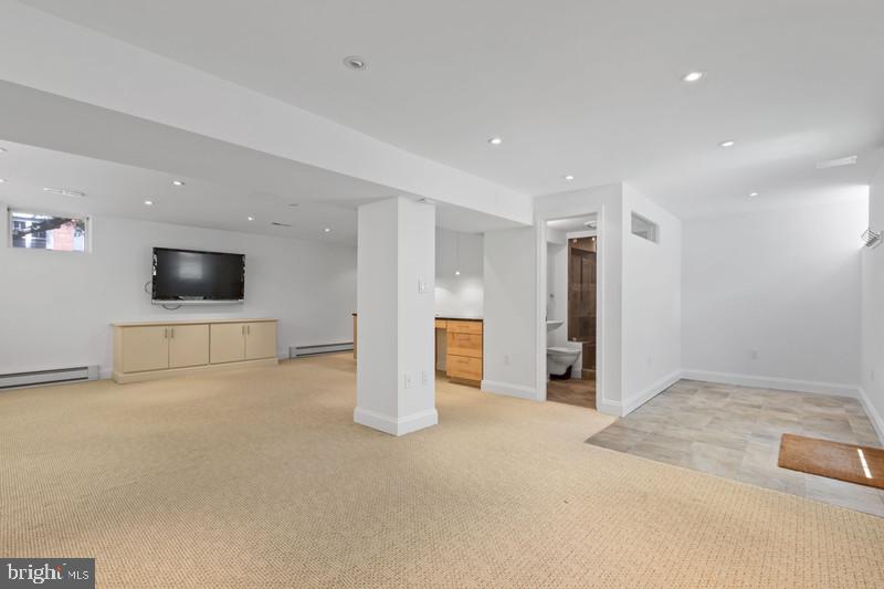 6701 Fairfax Road, Unit 76 Chevy Chase, MD 20815 - Photo 34 of 42 a view of a livingroom with an empty space and a couch
