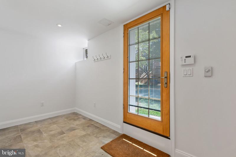 6701 Fairfax Road, Unit 76 Chevy Chase, MD 20815 - Photo 35 of 42 a view of empty room with floor to ceiling window