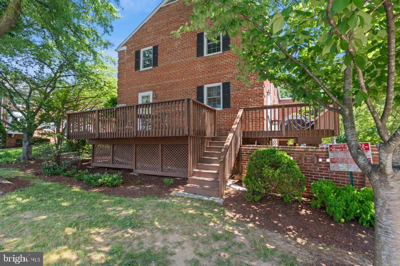 6701 Fairfax Road, Unit 76 Chevy Chase, MD 20815 - Photo 36 of 42 a view of a house with a yard and hanging chair