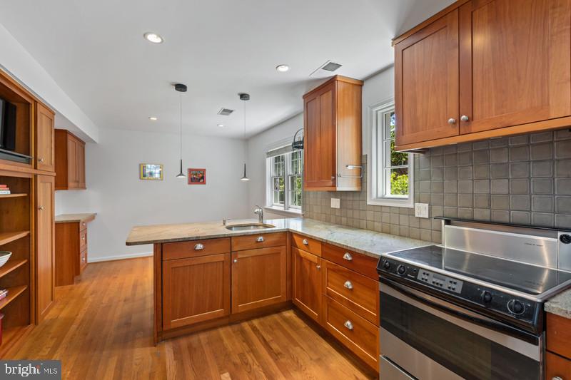6701 Fairfax Road, Unit 76 Chevy Chase, MD 20815 - Photo 10 of 42 a kitchen with stainless steel appliances granite countertop a sink and cabinets