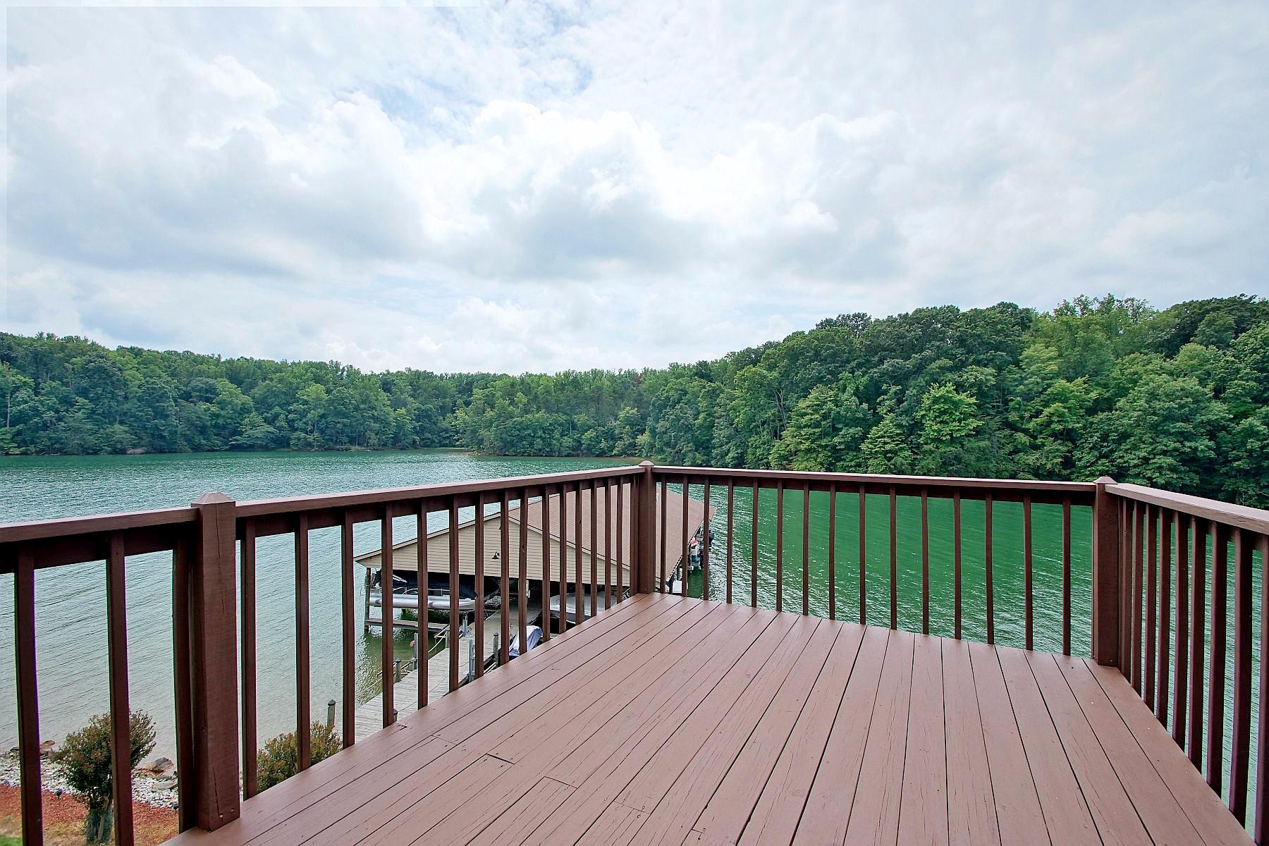 650 Monte Vista Road, Unit 403 Union Hall, VA 24176 - Photo 12 of 37 a balcony with wooden floor and fence