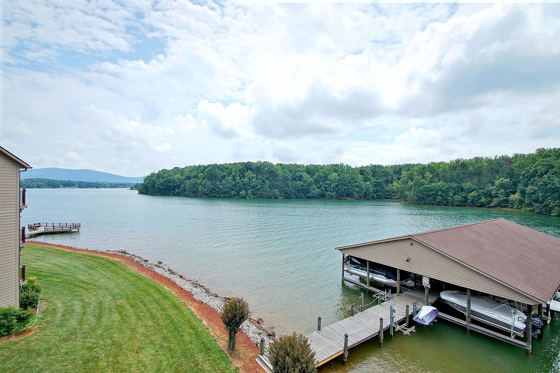 650 Monte Vista Road, Unit 403 Union Hall, VA 24176 - Photo 14 of 37 a view of a lake with houses in the background