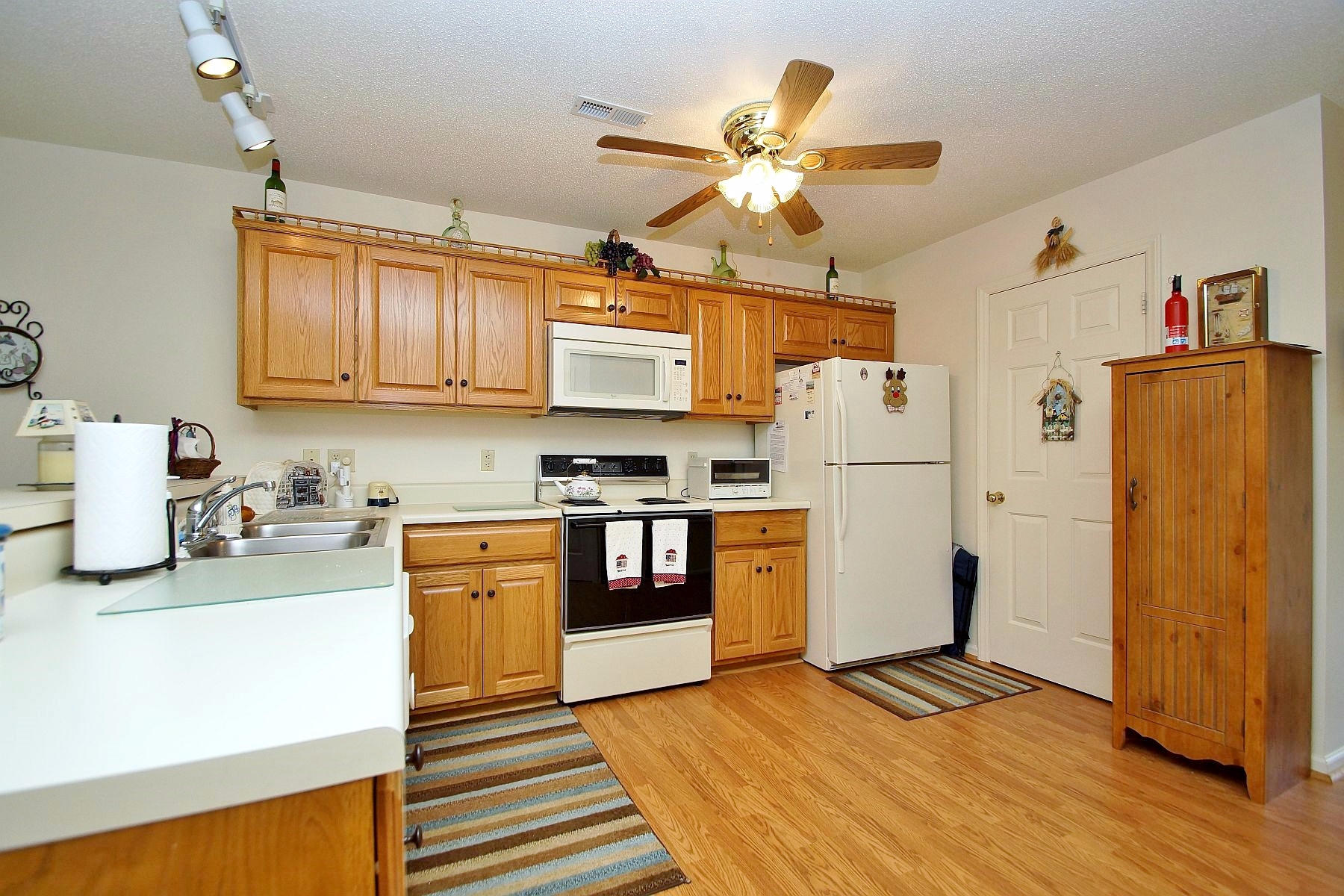 650 Monte Vista Road, Unit 403 Union Hall, VA 24176 - Photo 19 of 37 a kitchen with a refrigerator a stove cabinets and wooden floor