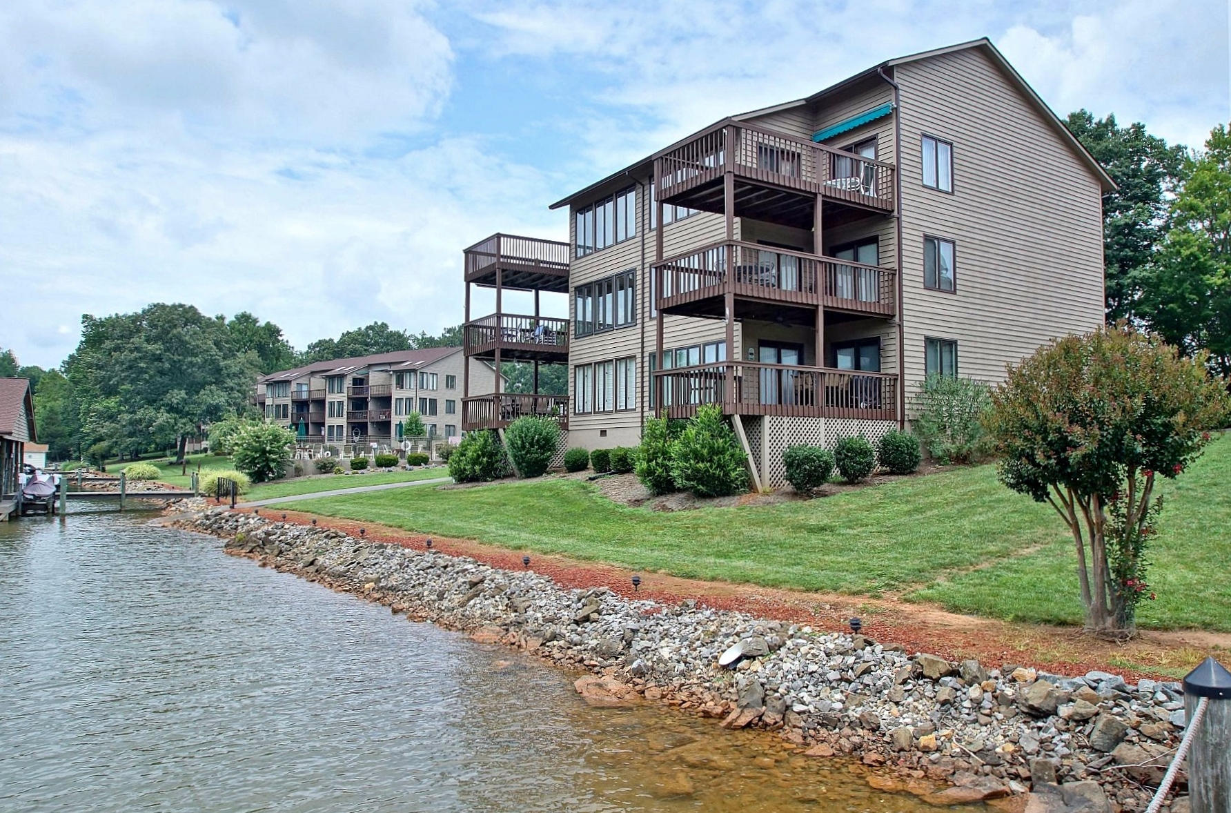 650 Monte Vista Road, Unit 403 Union Hall, VA 24176 - Photo 2 of 37 a front view of a house with a yard and a garage