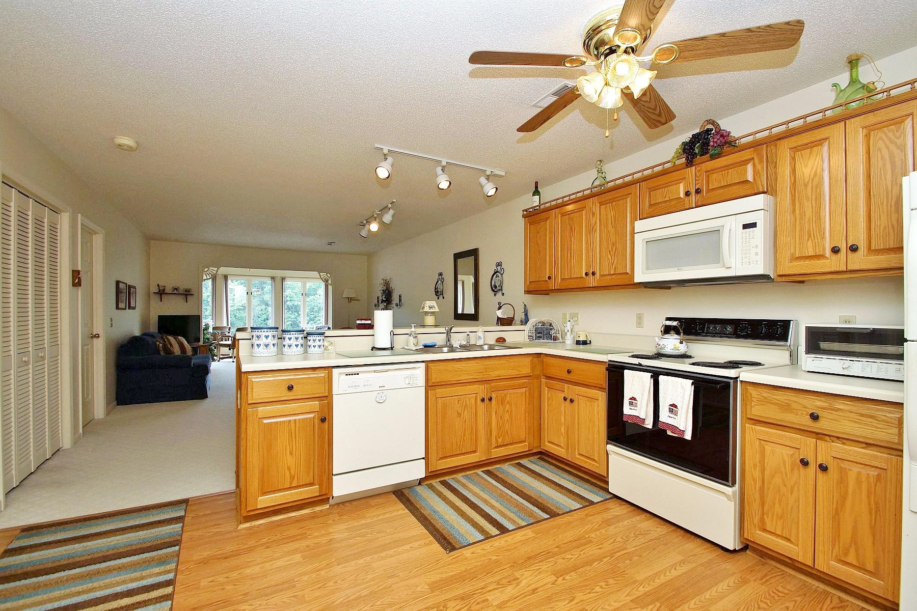 650 Monte Vista Road, Unit 403 Union Hall, VA 24176 - Photo 20 of 37 a large kitchen with stainless steel appliances granite countertop a stove and a sink