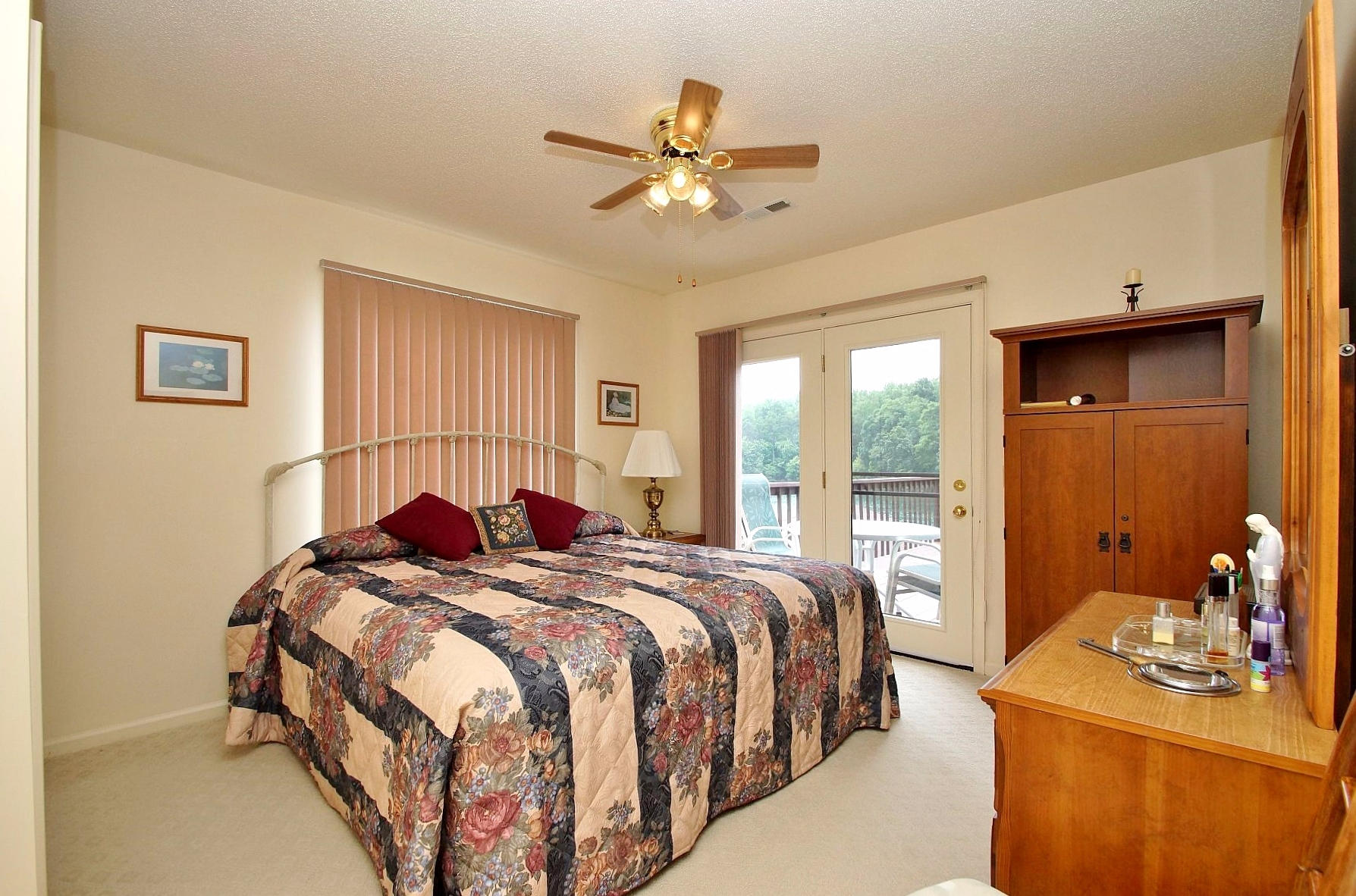 650 Monte Vista Road, Unit 403 Union Hall, VA 24176 - Photo 21 of 37 a bedroom with two beds and a chandelier