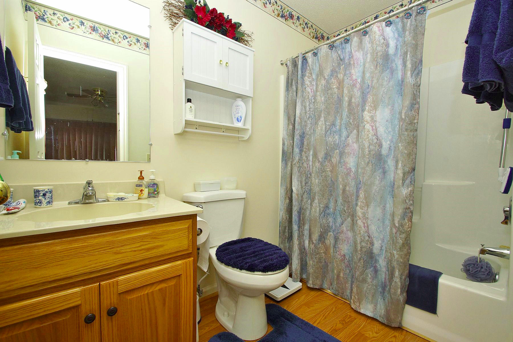 650 Monte Vista Road, Unit 403 Union Hall, VA 24176 - Photo 25 of 37 a bathroom with a granite countertop toilet sink and mirror