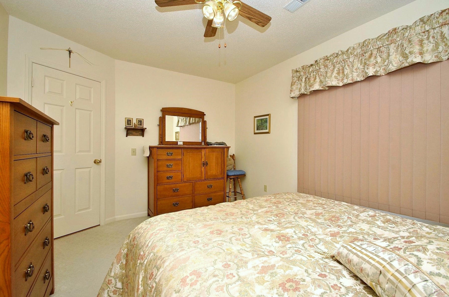 650 Monte Vista Road, Unit 403 Union Hall, VA 24176 - Photo 28 of 37 a bedroom with a bed and a chandelier