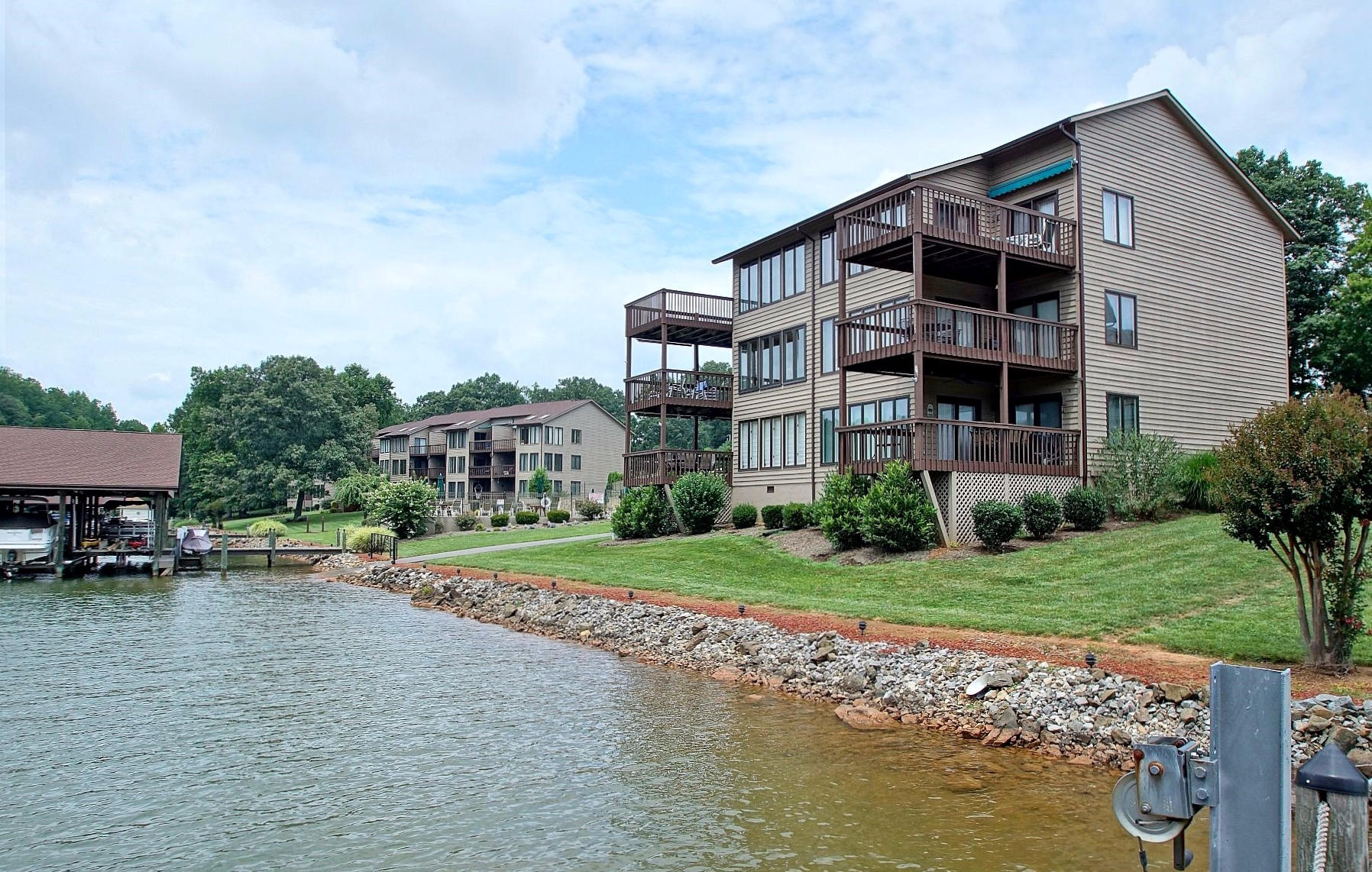 650 Monte Vista Road, Unit 403 Union Hall, VA 24176 - Photo 35 of 37 a front view of a house with a yard and lake view