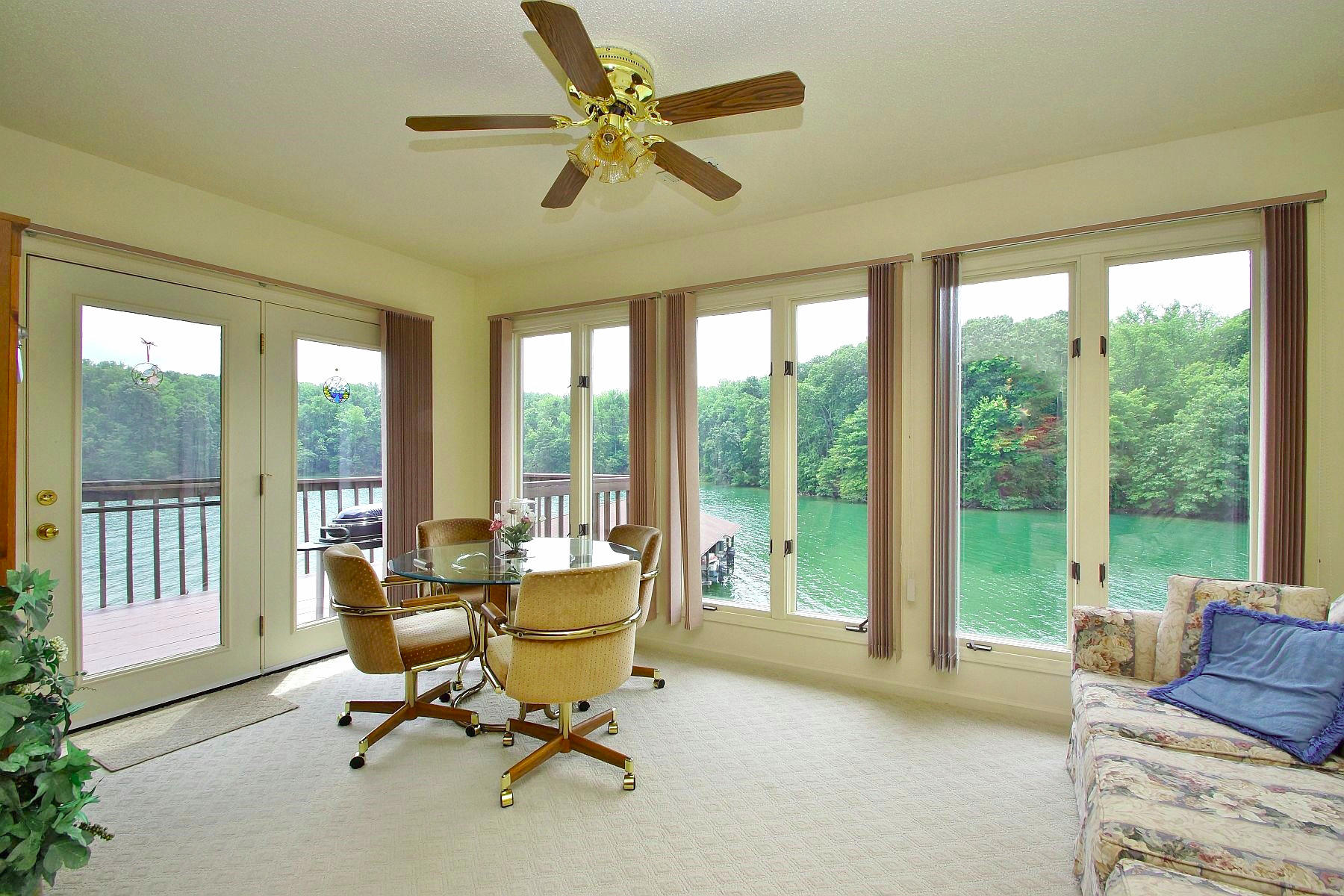 650 Monte Vista Road, Unit 403 Union Hall, VA 24176 - Photo 9 of 37 a living room with furniture and a floor to ceiling window