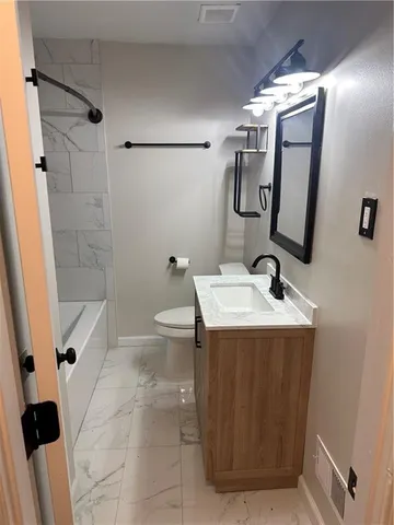 a bathroom with a sink and mirror