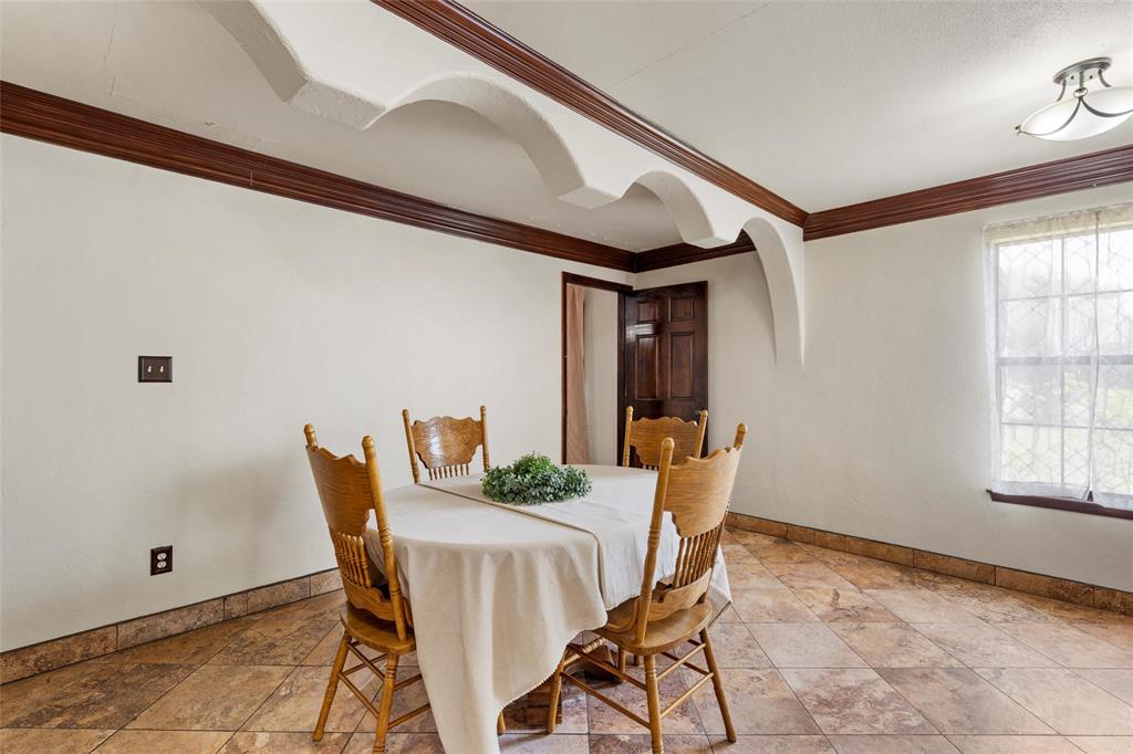 3433 West Tours Road West, TX 76691 - Photo 12 of 40 Dining room featuring baseboards and crown molding