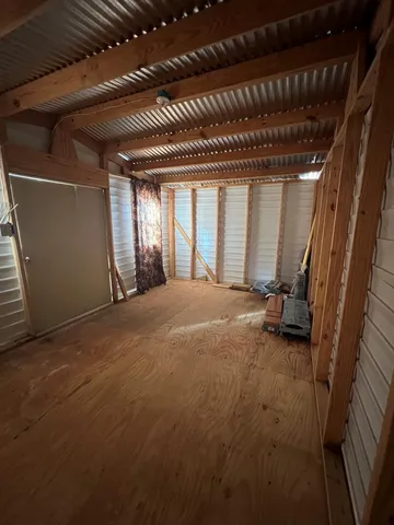 a view of an empty room with a fireplace