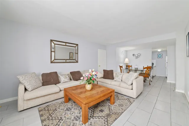 a living room with furniture and a rug