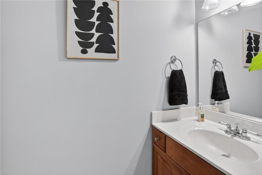 2825 Northeast Expressway, Unit J3 Atlanta, GA 30345 - Photo 12 of 23 a bathroom with double vanity sink and a mirror