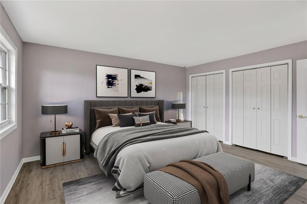 2825 Northeast Expressway, Unit J3 Atlanta, GA 30345 - Photo 14 of 23 a bedroom with a bed and a night stand