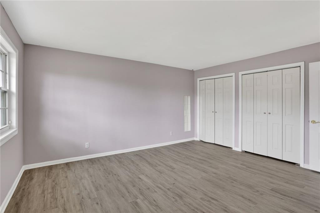 2825 Northeast Expressway, Unit J3 Atlanta, GA 30345 - Photo 16 of 23 a view of an empty room with wooden floor and a window