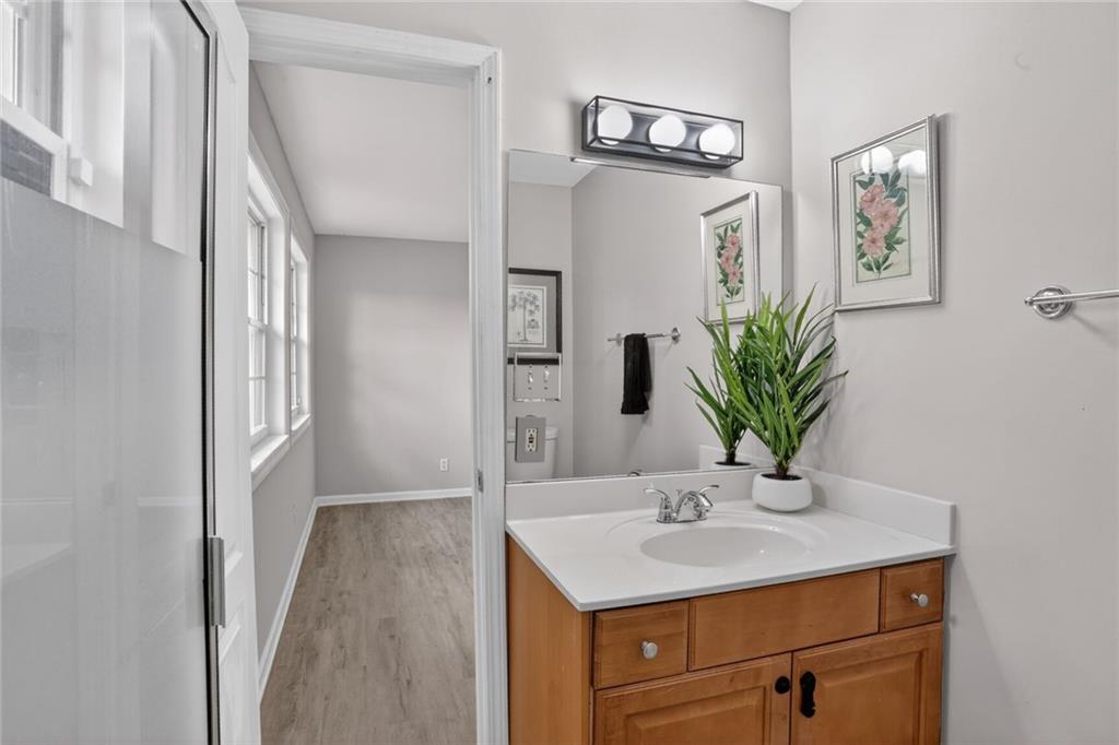 2825 Northeast Expressway, Unit J3 Atlanta, GA 30345 - Photo 18 of 23 a bathroom with a sink a mirror and vanity