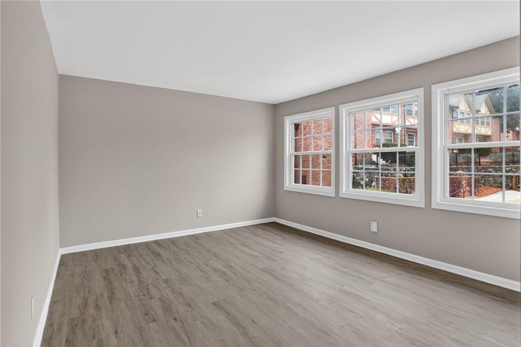 2825 Northeast Expressway, Unit J3 Atlanta, GA 30345 - Photo 19 of 23 wooden floor in an empty room with a window